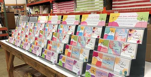 Newly printed 'The She Collection' books sit in displays at Gently Spoken's Minnesota warehouse, ready to ship