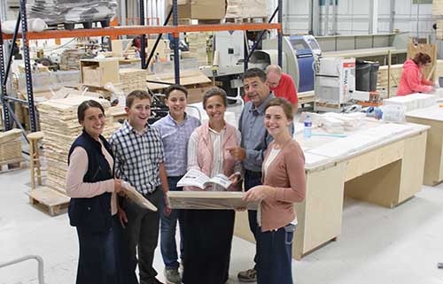 Brad and Michelle Luethold and family started their décor business in their basement, but now employ 30 in their Iowa facility.